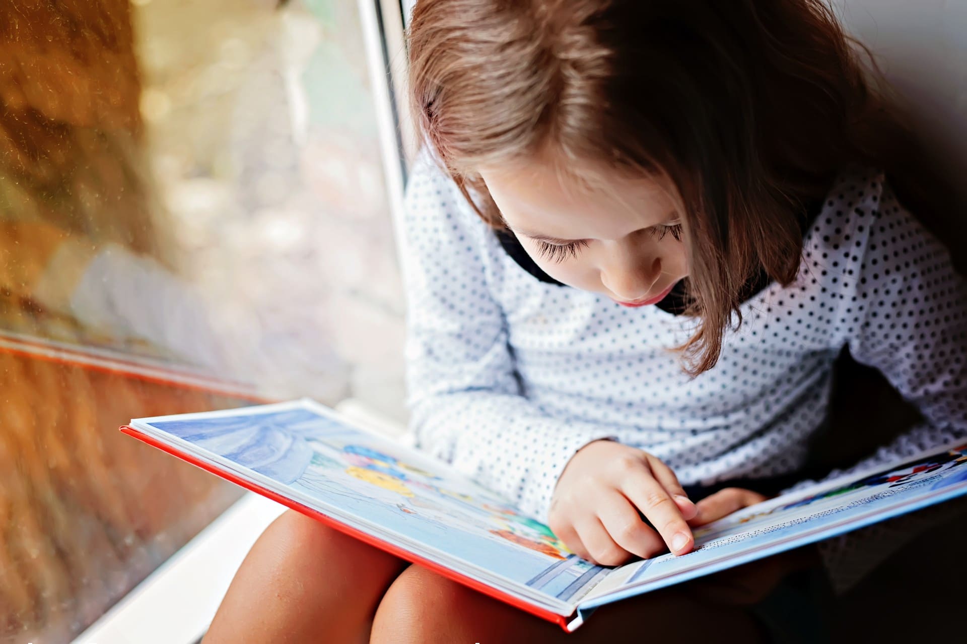 Child reading a book